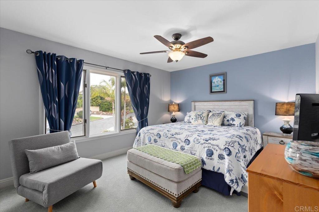 1838 Samoa Way Oceanside, CA 92054 - Photo 30 of 49 a bedroom with a bed couch and window
