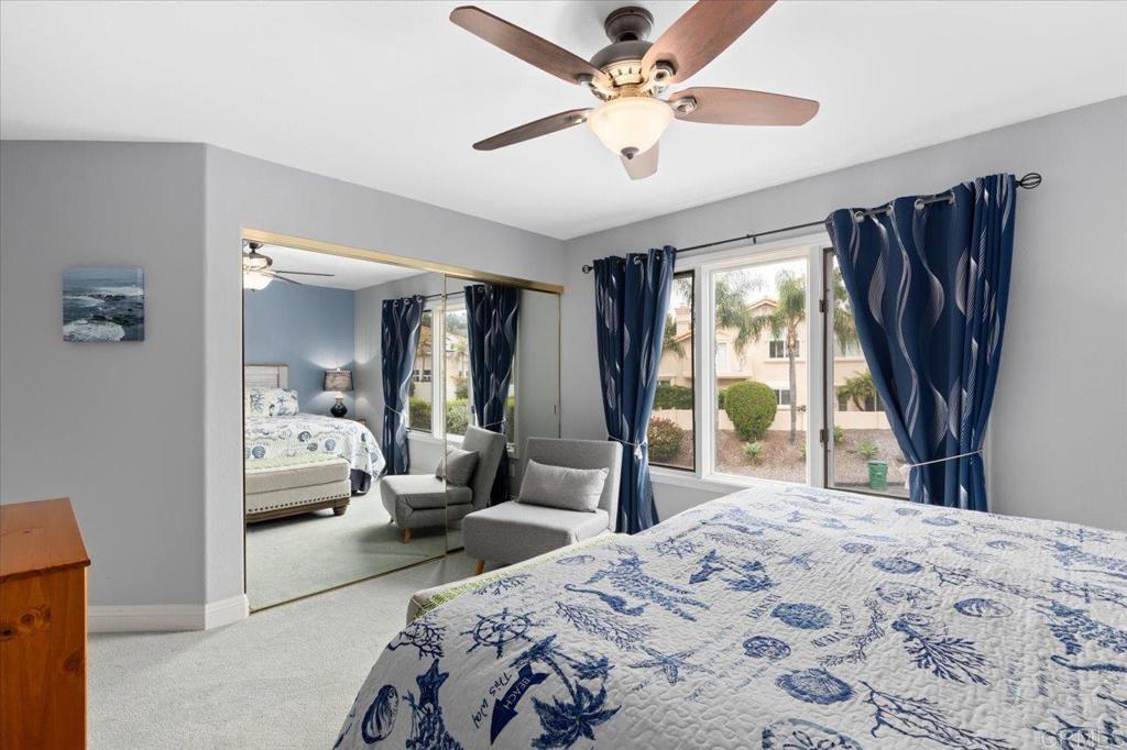 1838 Samoa Way Oceanside, CA 92054 - Photo 31 of 49 a bedroom with a bed large window with couch