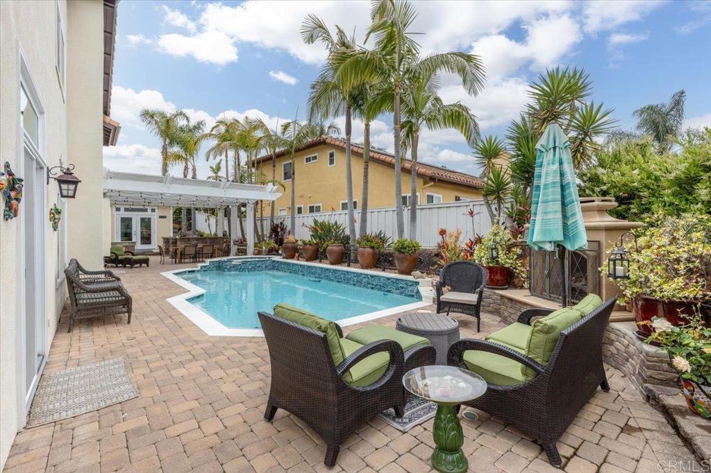 1838 Samoa Way Oceanside, CA 92054 - Photo 35 of 49 a view of a patio with couches table and chairs and potted plants