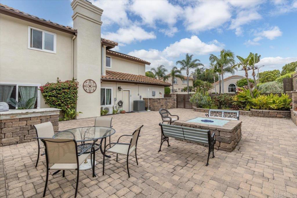 1838 Samoa Way Oceanside, CA 92054 - Photo 39 of 49 a view of a patio with a table and chairs