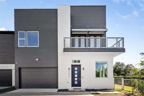 a front view of a house with a garage