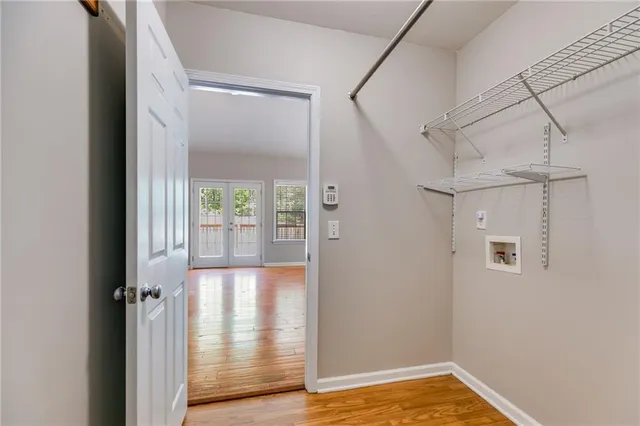 a view of a glass door with wooden floor