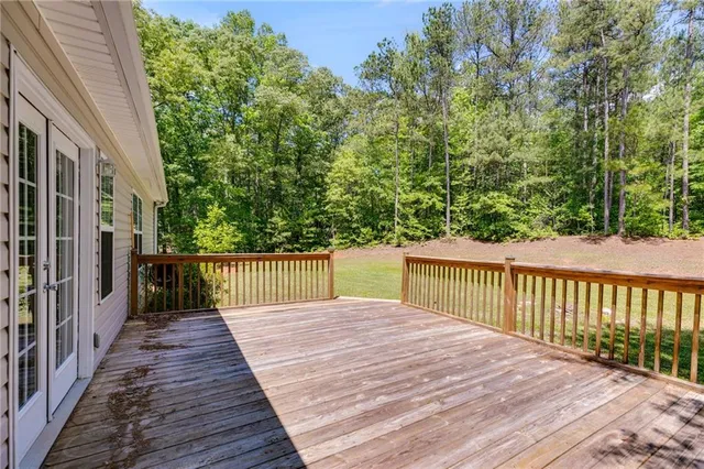 a balcony with trees in front of it