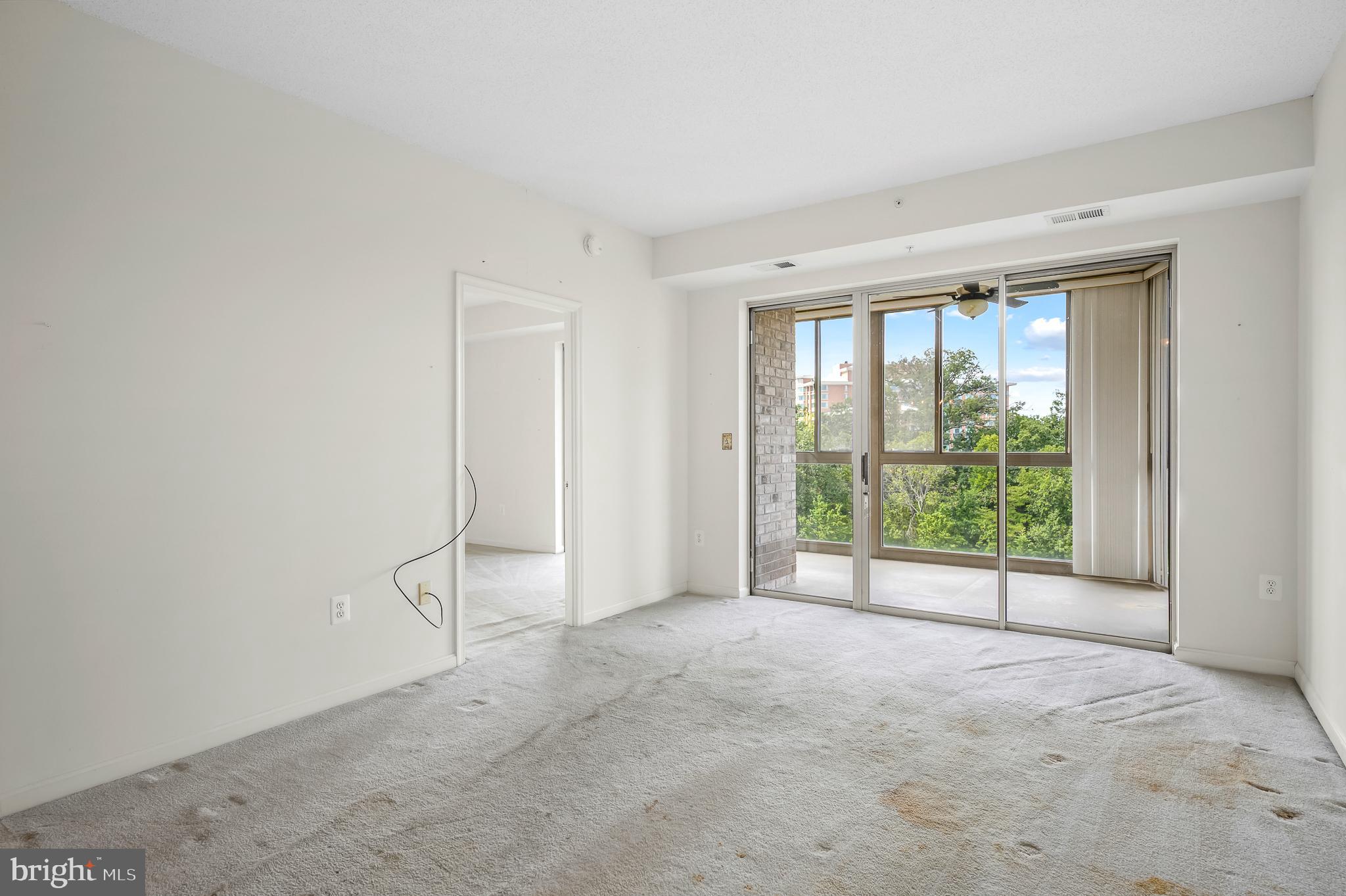 19365 Cypress Ridge Terrace, Unit 519 Leesburg, VA 20176 - Photo 1 of 24 a view of an empty room with a window
