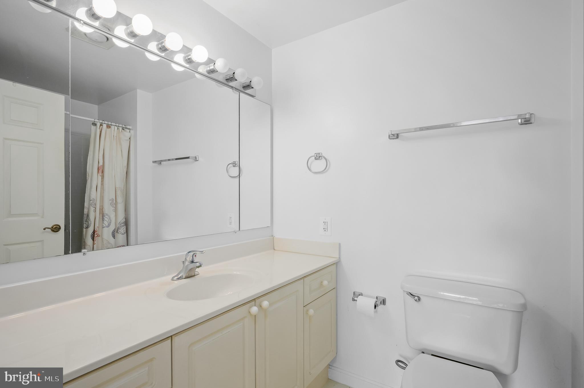 19365 Cypress Ridge Terrace, Unit 519 Leesburg, VA 20176 - Photo 12 of 24 a bathroom with a sink vanity granite and toilet