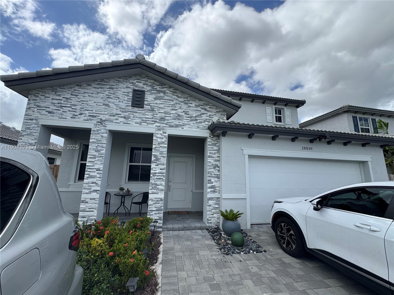 28850 Southwest 163rd Avenue, Unit 1 Homestead, FL 33033 - Photo 2 of 14 a view of a car garage