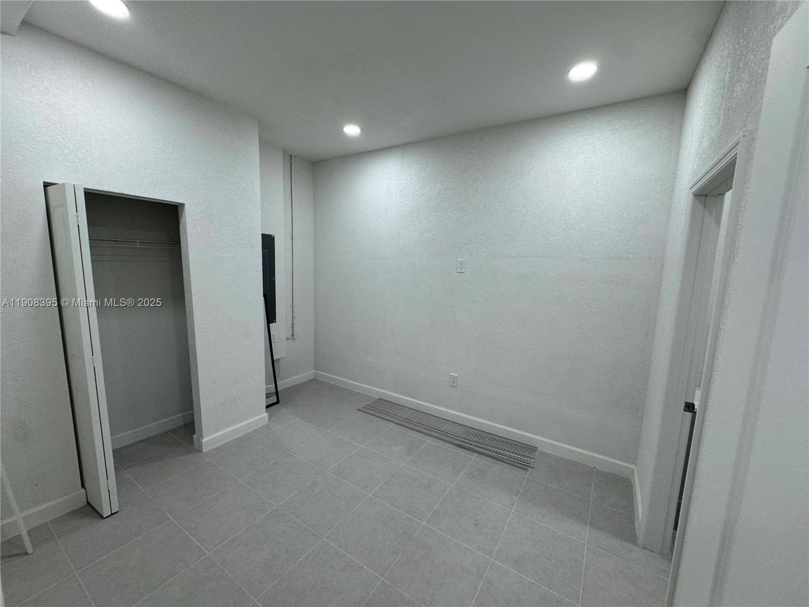 28850 Southwest 163rd Avenue, Unit 1 Homestead, FL 33033 - Photo 5 of 14 an empty room with closet