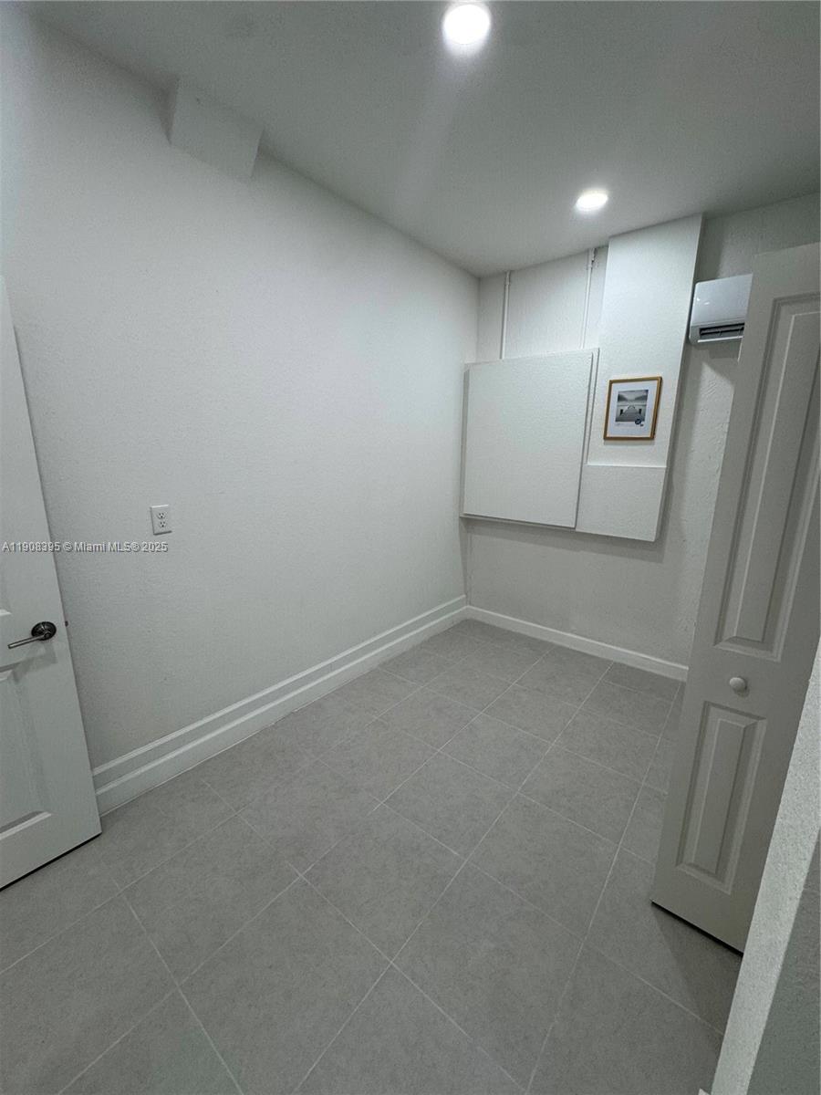 28850 Southwest 163rd Avenue, Unit 1 Homestead, FL 33033 - Photo 9 of 14 wooden floor in an empty room