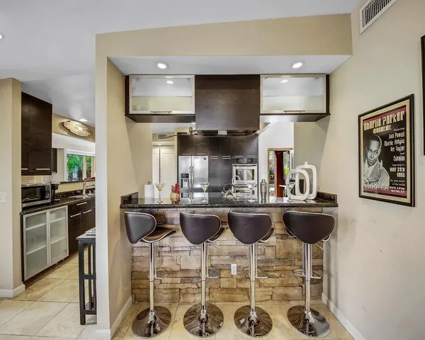 a patio with table and chairs