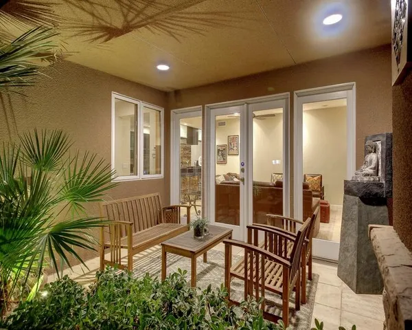 a view of a house with a yard and a garage