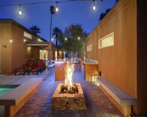 a view of a lobby with a patio and dining area