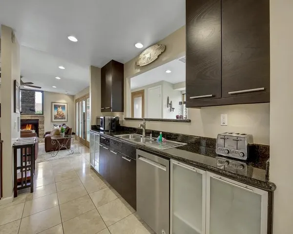 a kitchen with a stove a sink and a microwave