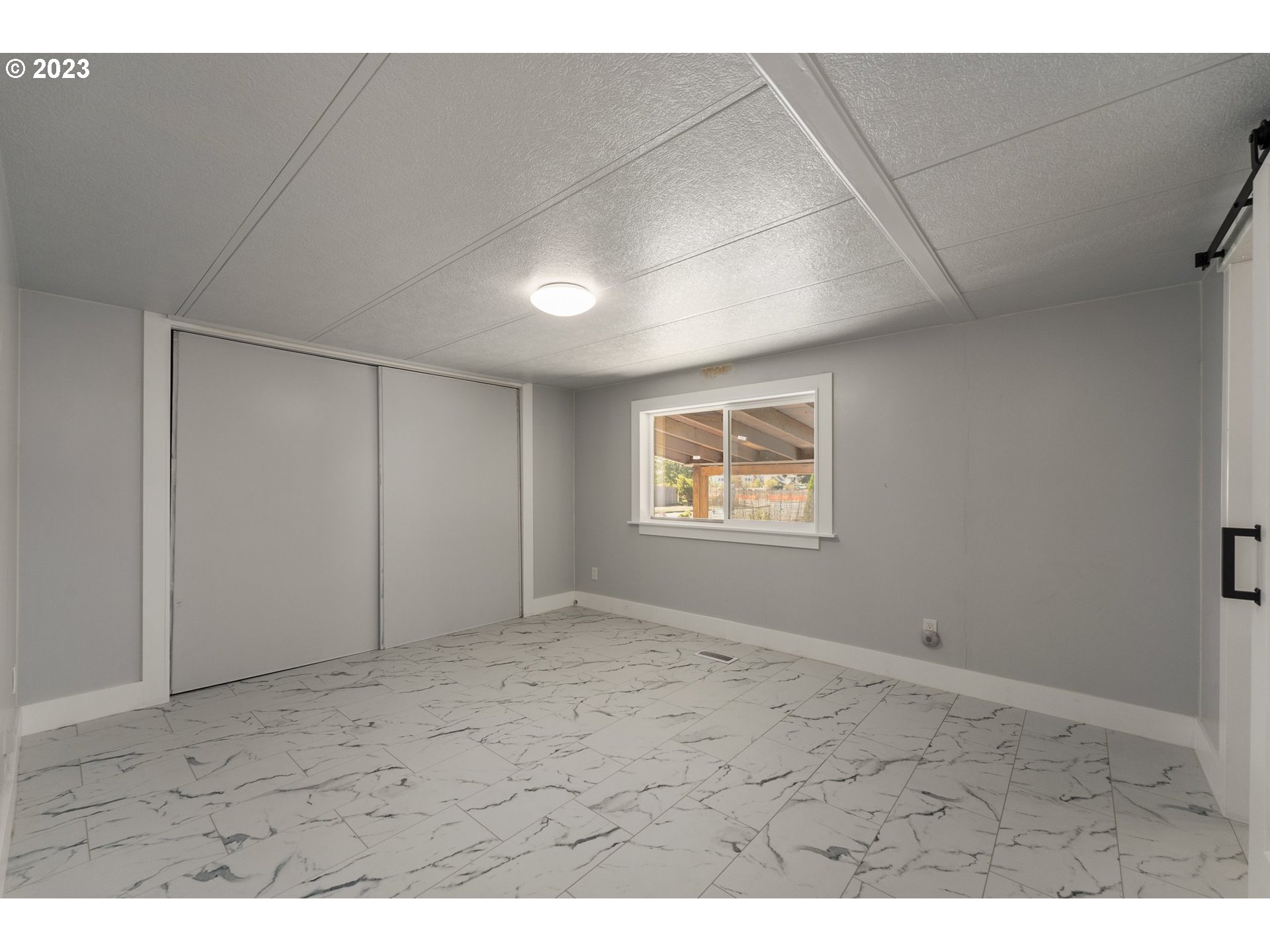 3130 U Street Springfield, OR 97477 - Photo 11 of 28 a view of an empty room with a window