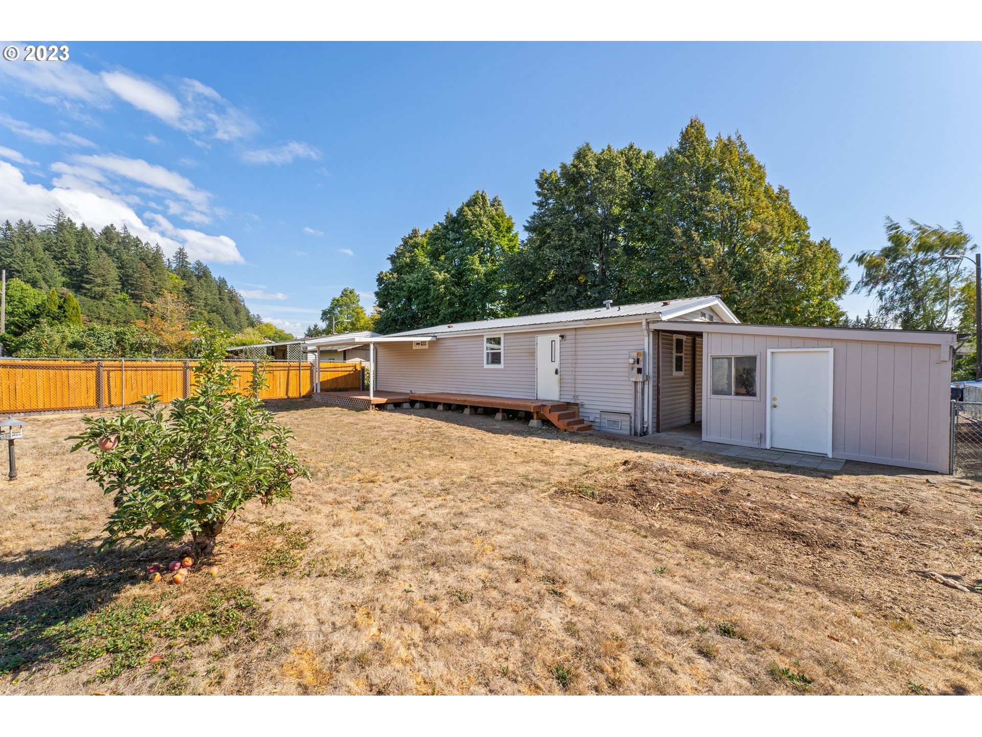 3130 U Street Springfield, OR 97477 - Photo 21 of 28 a view of a house with a backyard