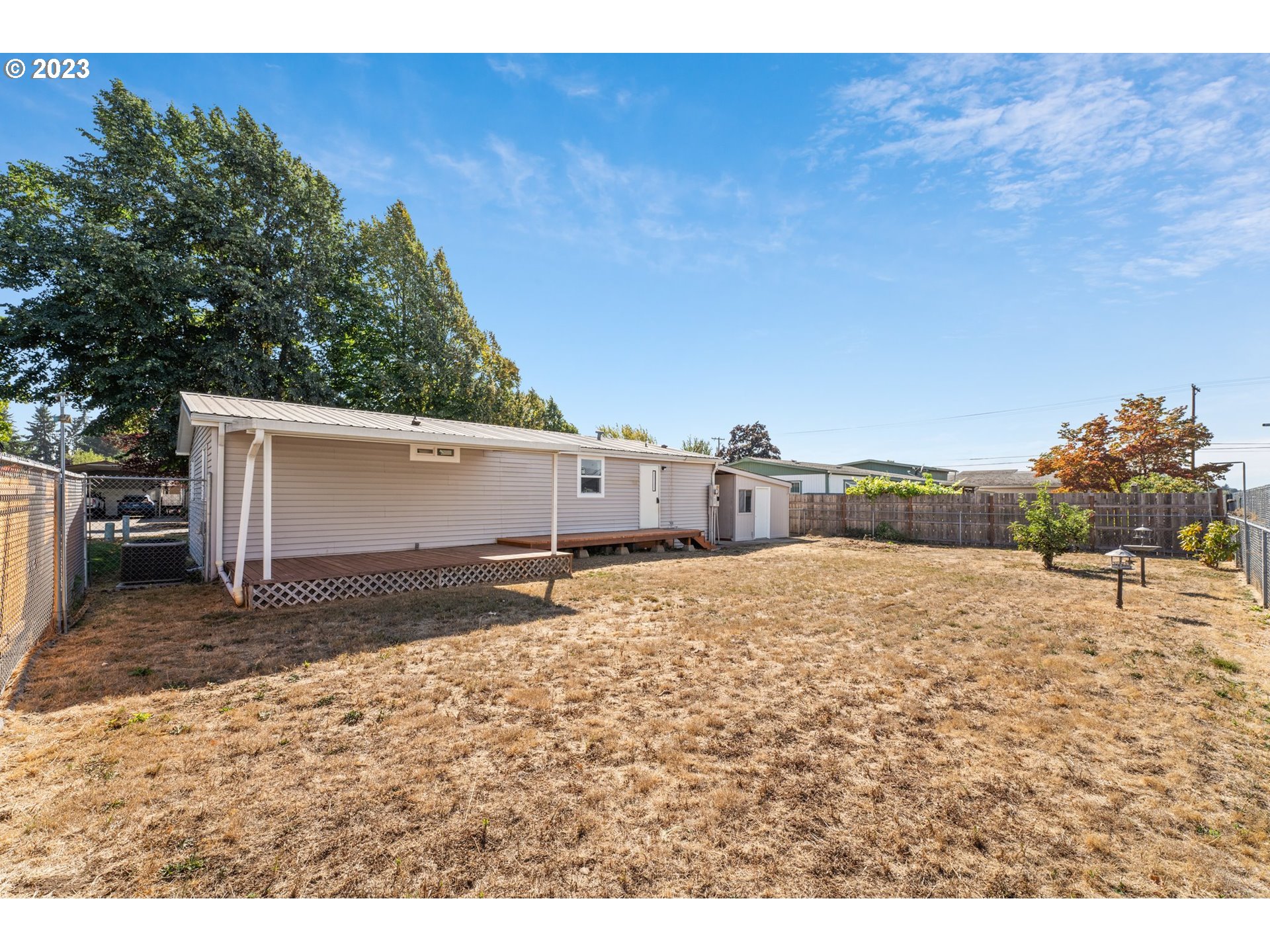 3130 U Street Springfield, OR 97477 - Photo 23 of 28 a view of back yard and basketball court
