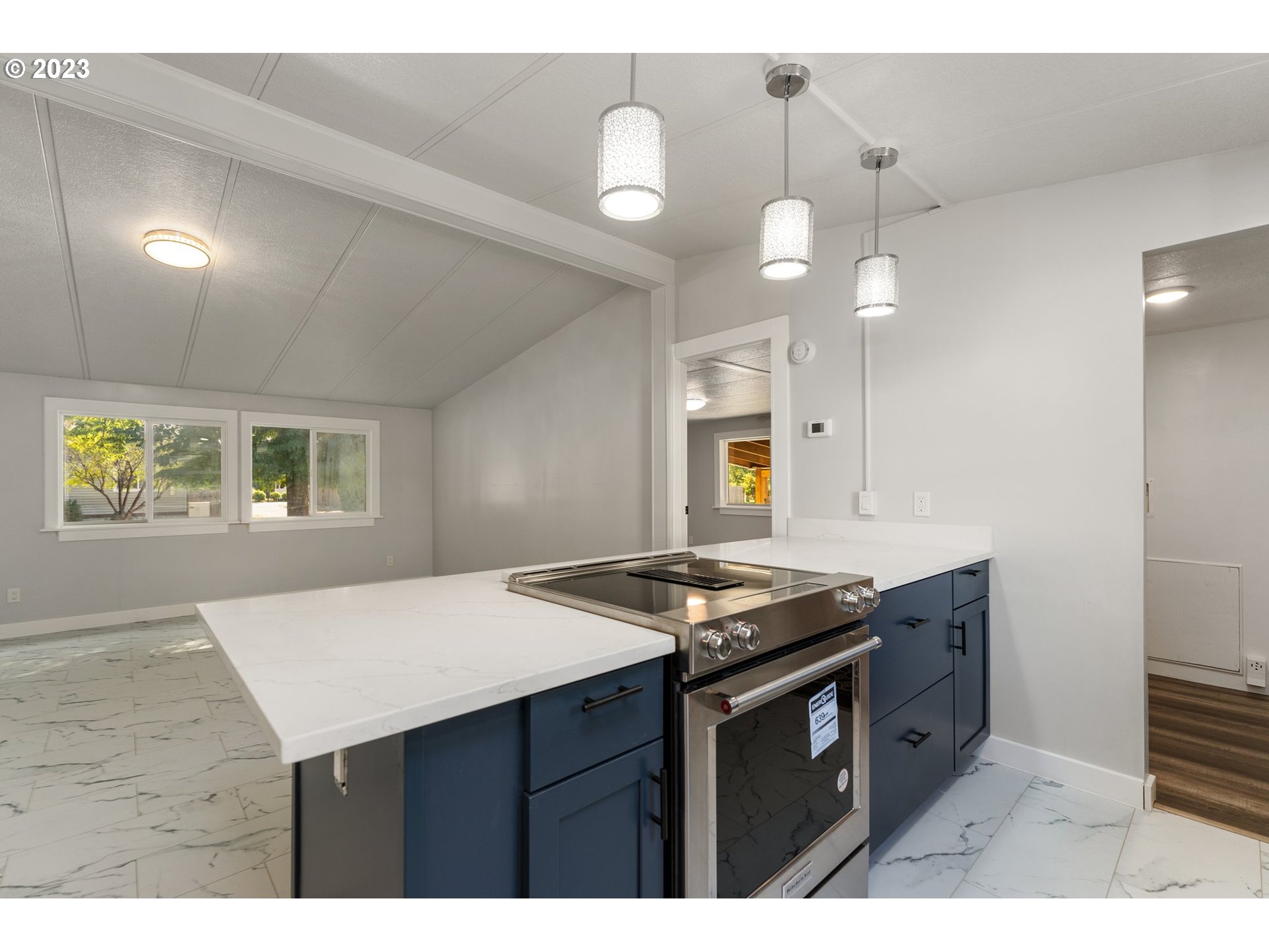 3130 U Street Springfield, OR 97477 - Photo 5 of 28 a kitchen with a stove and a refrigerator
