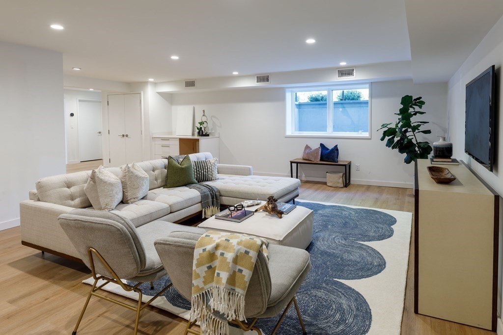 43 Ruane Road Newton, MA 02465 - Photo 20 of 24 a living room with furniture and a potted plant