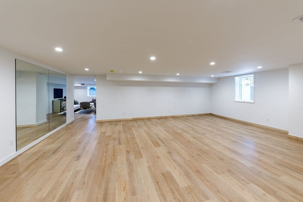 43 Ruane Road Newton, MA 02465 - Photo 21 of 24 a view of empty room with wooden floor