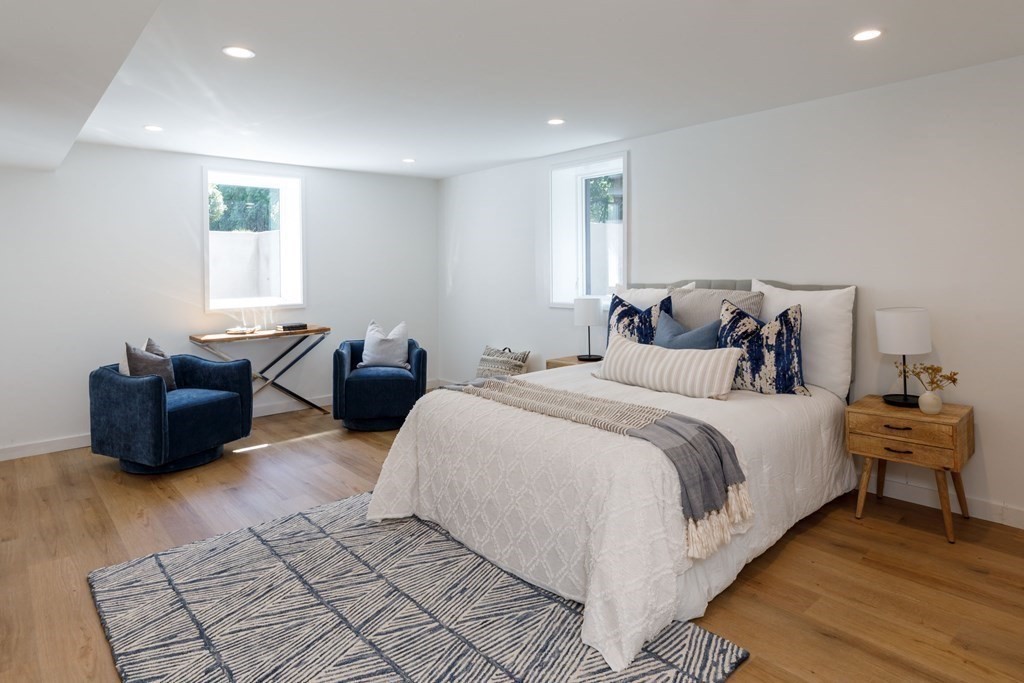 43 Ruane Road Newton, MA 02465 - Photo 22 of 24 a spacious bedroom with a bed and window