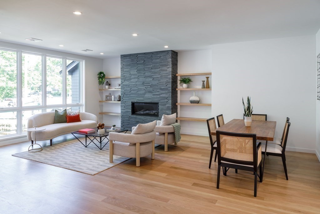 43 Ruane Road Newton, MA 02465 - Photo 7 of 24 a living room with furniture a rug and a fireplace