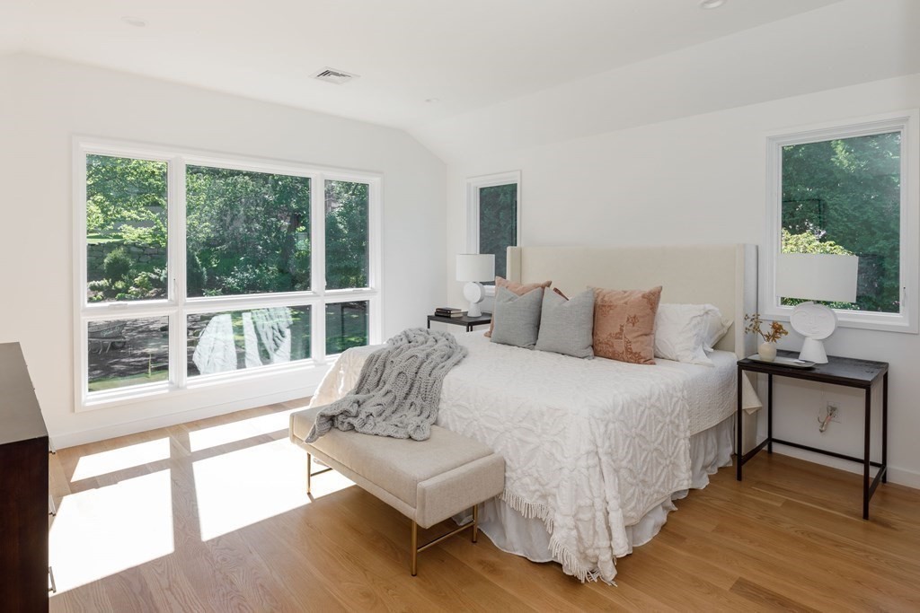 43 Ruane Road Newton, MA 02465 - Photo 9 of 24 a bedroom with a bed and a large window