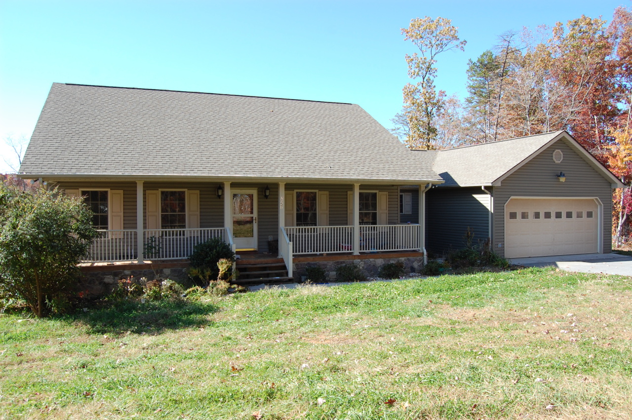 2057 Morgans Mill Road Goodview, VA 24095 - Photo 18 of 18 a view of a house with a garden