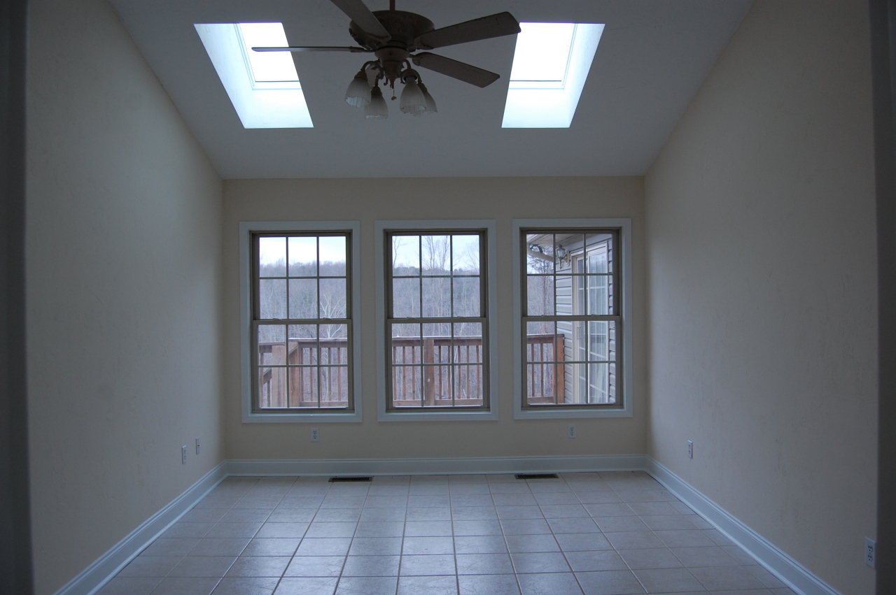 2057 Morgans Mill Road Goodview, VA 24095 - Photo 4 of 18 an empty room with windows