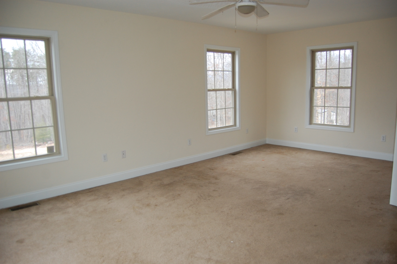 2057 Morgans Mill Road Goodview, VA 24095 - Photo 8 of 18 an empty room with windows