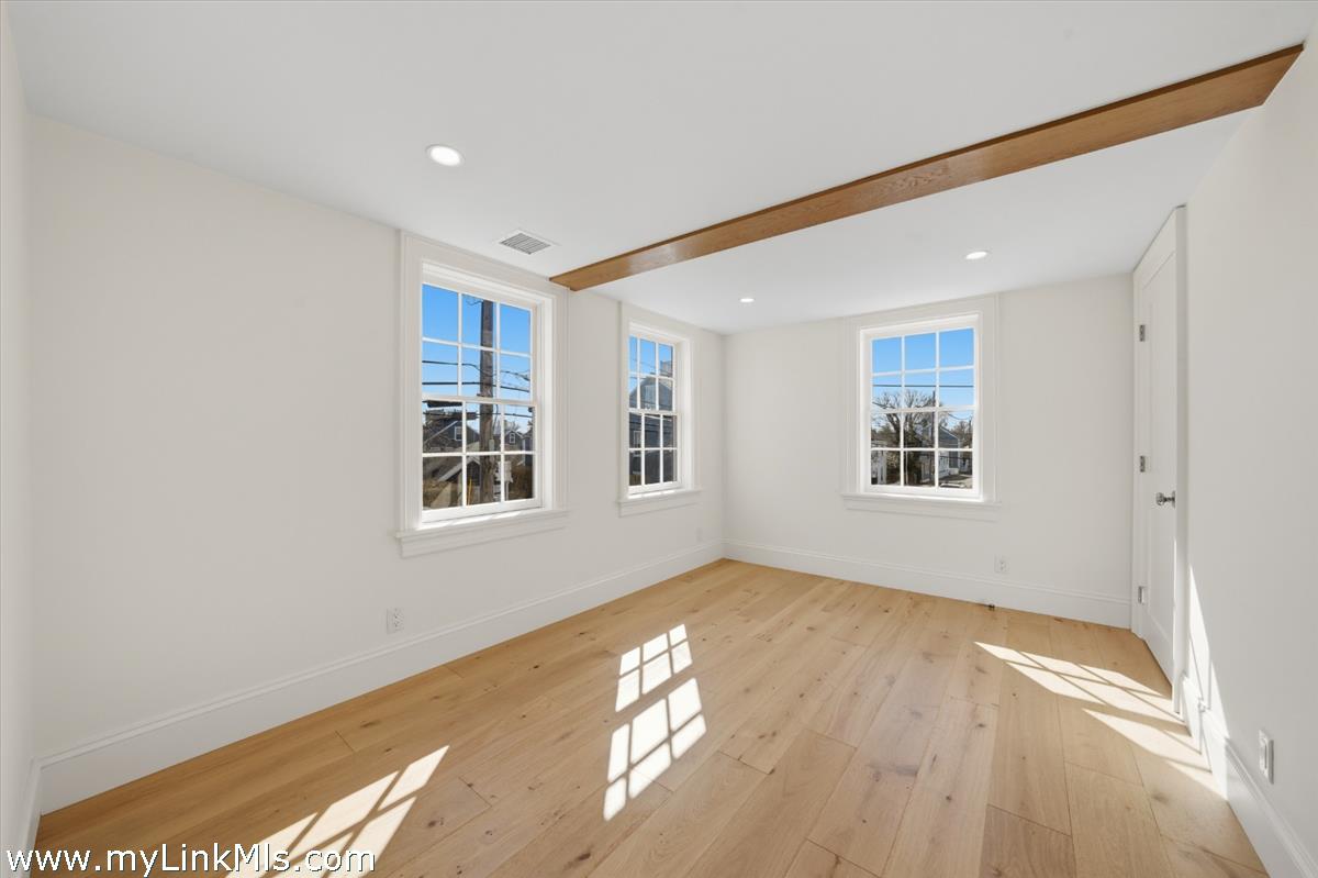 85 Orange Street Nantucket, MA 02554 - Photo 70 of 89 a view of an empty room and a window