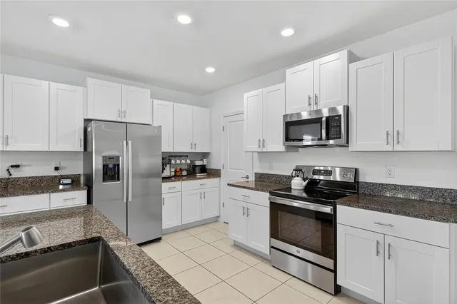 a bedroom with furniture and white walls