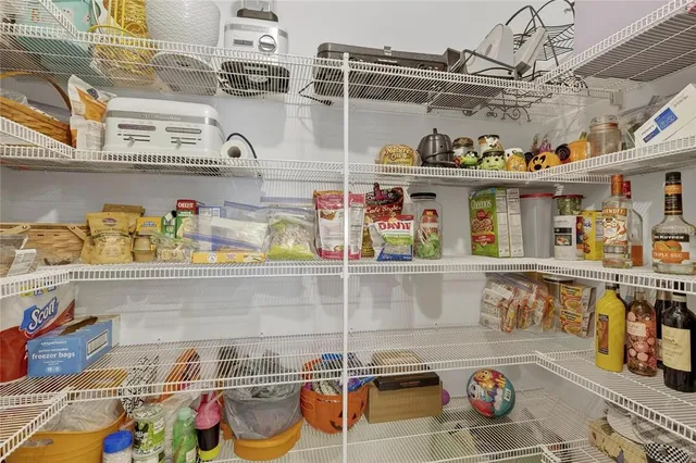 a spacious bedroom with a bed and a couch