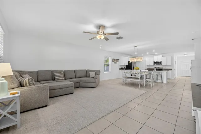 a view of staircase with white walls and utility