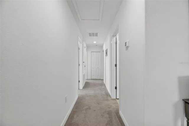 a view of a dining room with furniture and window