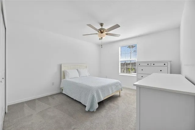 a living room with lots of furniture and a large window