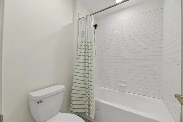 an aerial view of residential houses with outdoor space and swimming pool