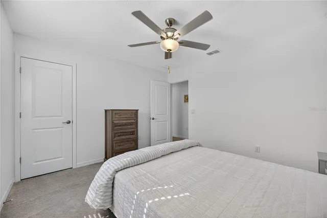 a view of a swimming pool with outdoor seating