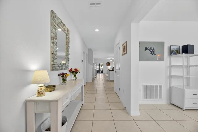a kitchen with a sink a kitchen island and stainless steel appliances