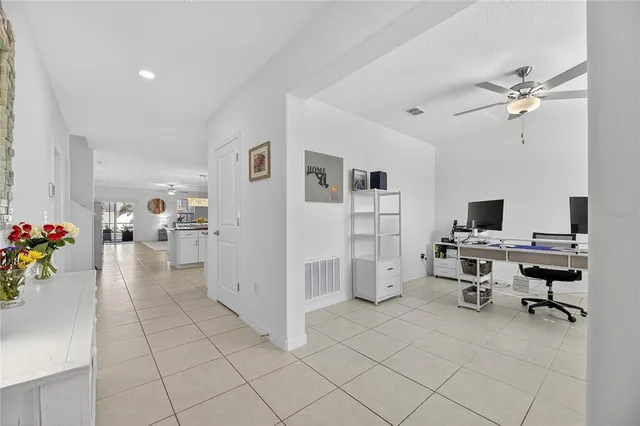 a kitchen with stainless steel appliances granite countertop a stove a sink a microwave and a refrigerator