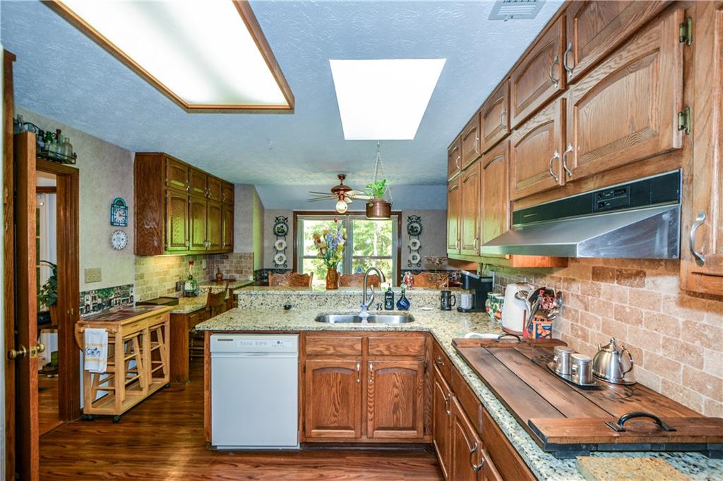 130 Hawn Road Fayetteville, GA 30215 - Photo 13 of 67 a kitchen with stainless steel appliances granite countertop a stove a sink and a refrigerator