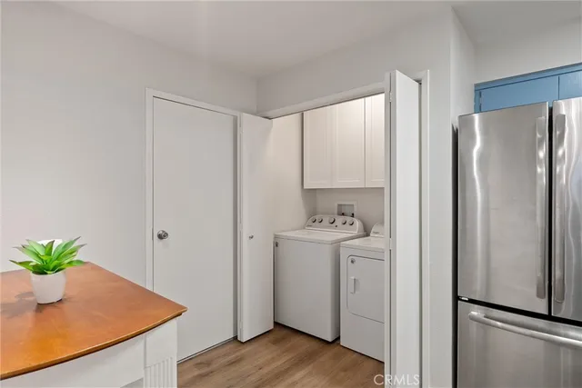a view of kitchen with furniture and wooden floor