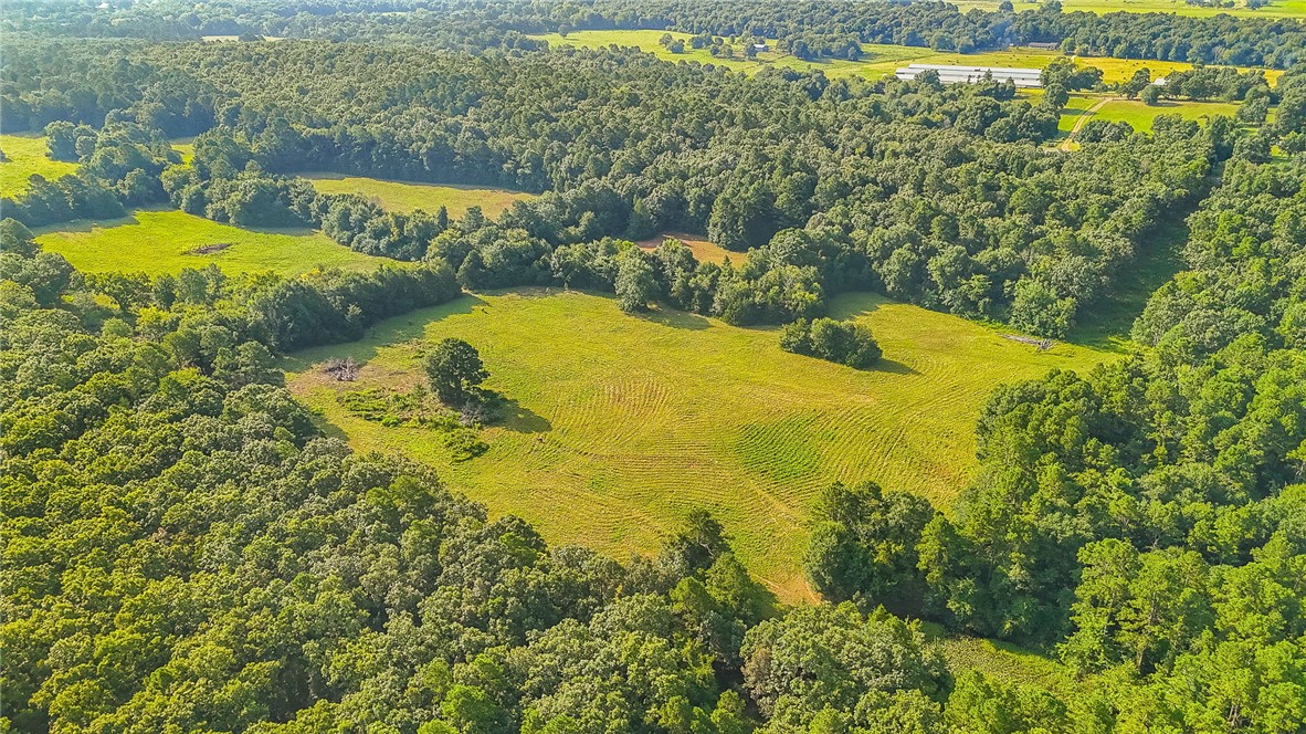 Square Rock Road Waldron, AR 72958 - Photo 5 of 16 Expansive acreage featuring multiple cleared pastures surrounded by mature woodlands