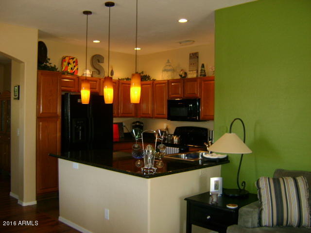 11174 West Berkeley Road Avondale, AZ 85392 - Photo 5 of 41 a kitchen with a sink and cabinets