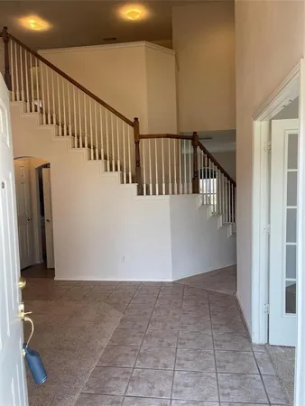 a view of a hallway with staircase
