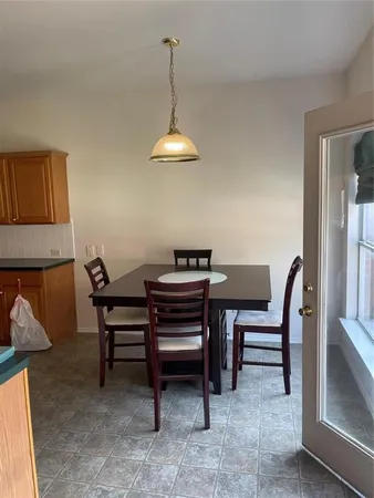 a kitchen with stainless steel appliances a sink and a refrigerator