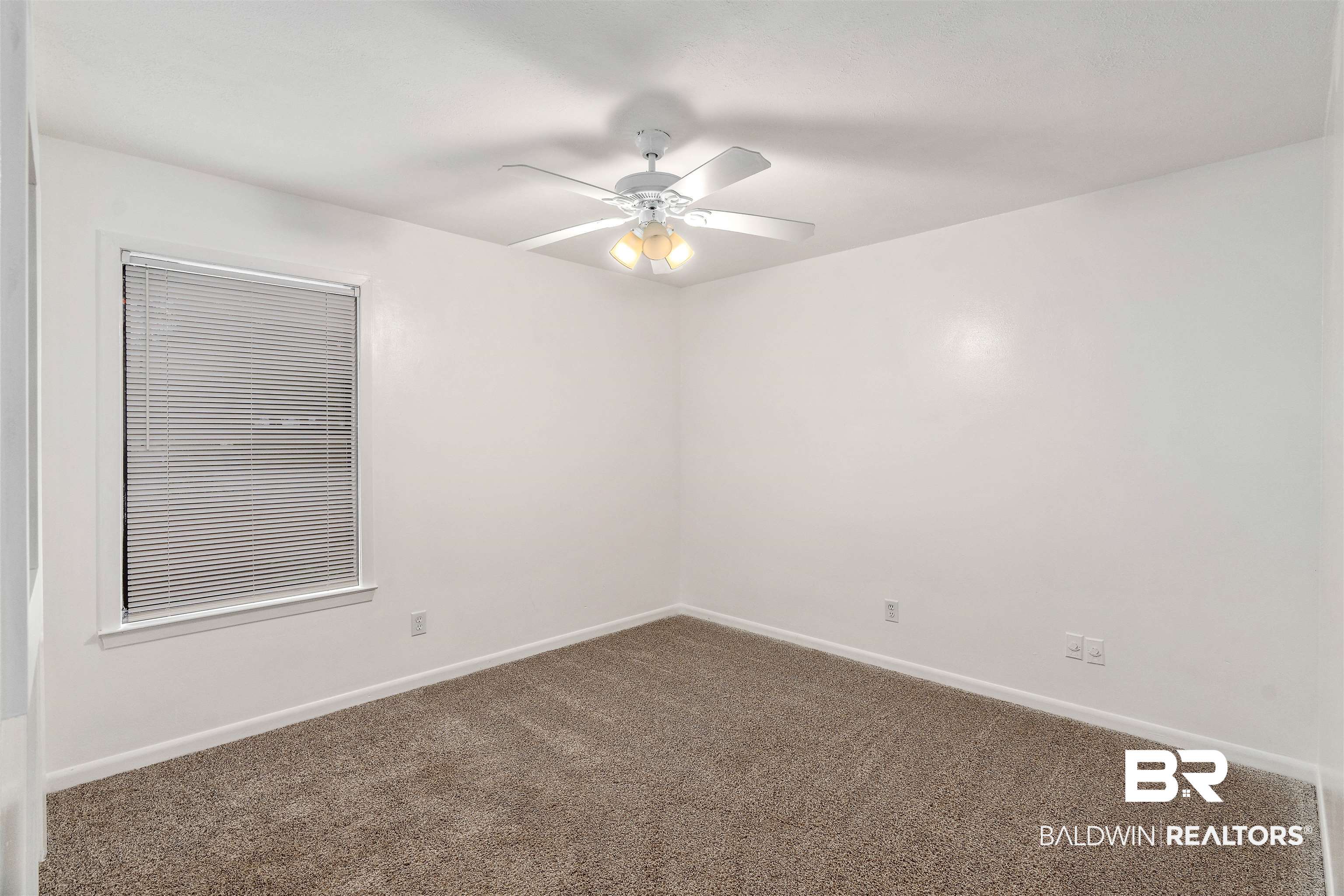 159 Montclair Loop Daphne, AL 36526 - Photo 11 of 18 Spare room featuring carpet and ceiling fan