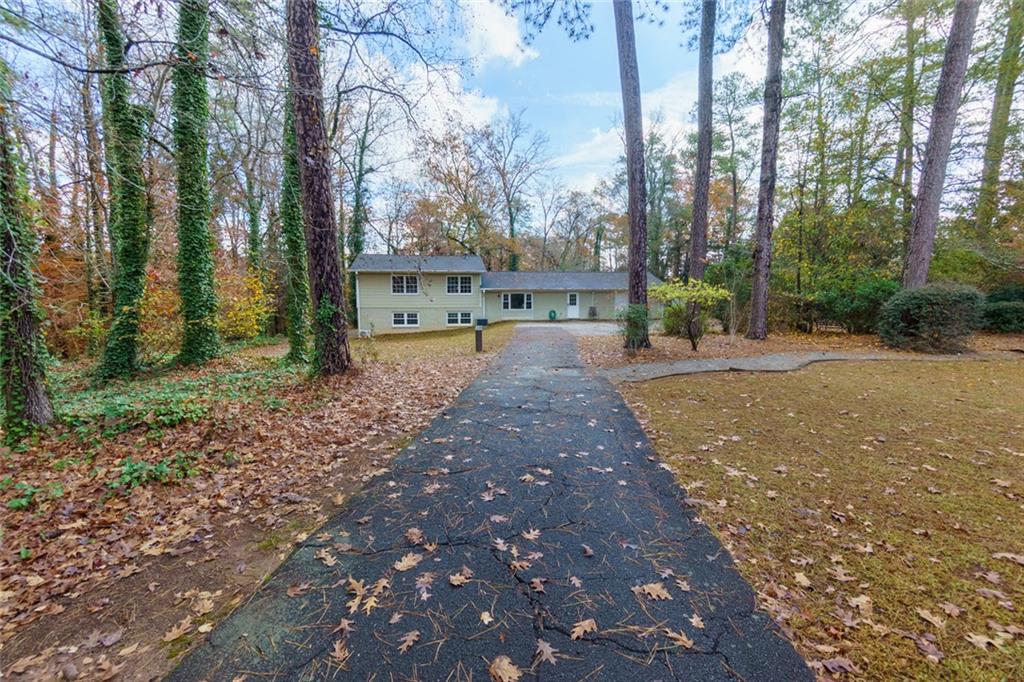 a swimming pool view with a backyard space