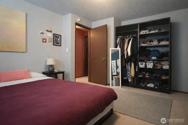 a bedroom with a bed and a walk in closet