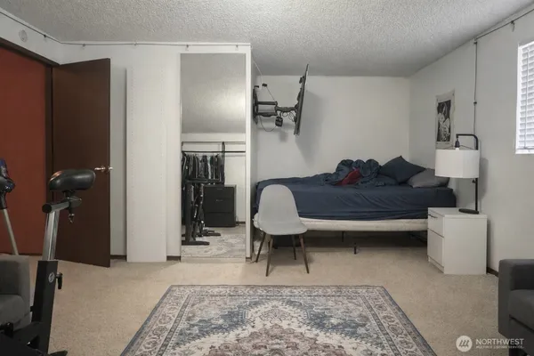 a living room with furniture and a rug