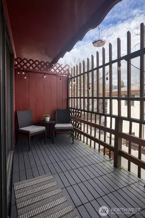 a view of a balcony with furniture