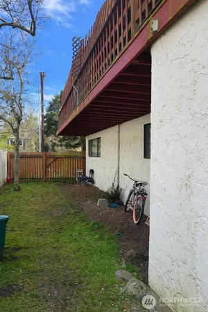 a backyard of a house with wooden fence